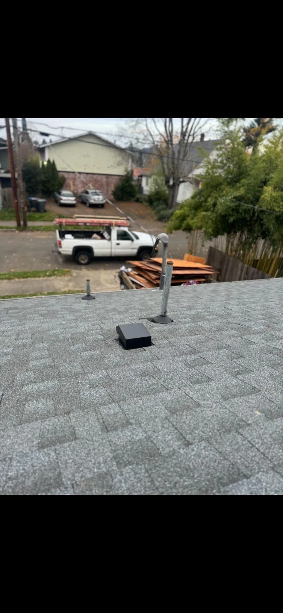 Black device on roof with a truck in background