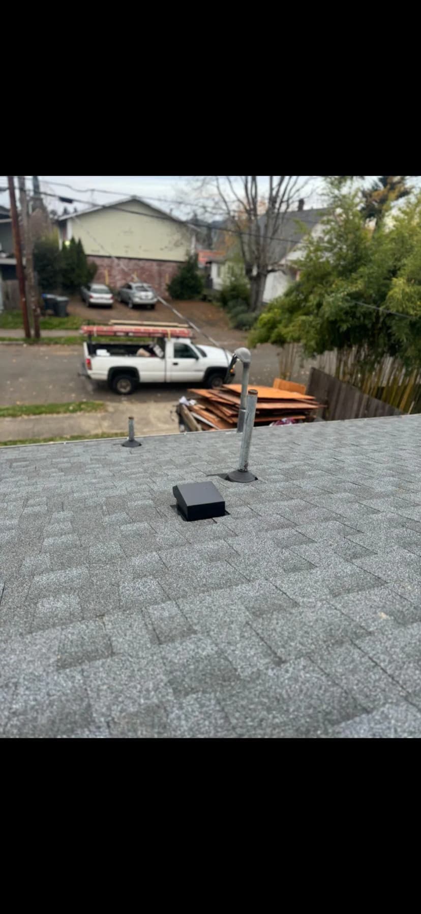 Black device on roof with a truck in background