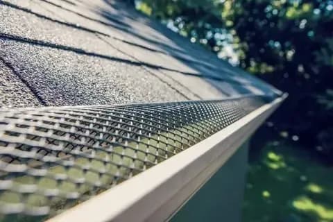 Close-up of a gutter guard on a roof
